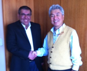 In this photo, OpenIAM President & CEO Suneet Shah shakes hands with Information Development's President & CEO Masaki Funakoshi.